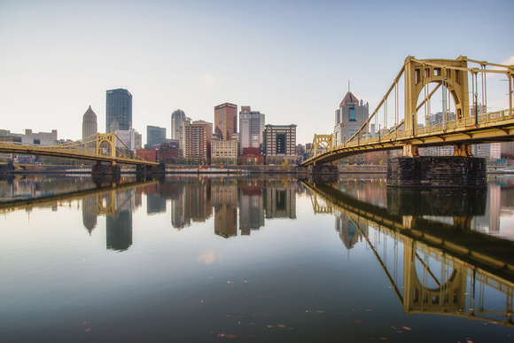 Pittsburgh and the Roberto Clemente Bridge reflect in the early morning HDR