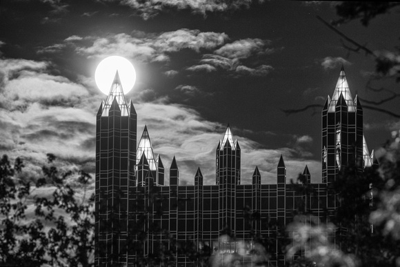 Black and white view of the supermoon sitting atop PPG Place
