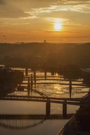 A golden sunrise above the Allegheny River