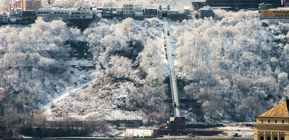 Sunlight illuminates Mt. Washington and the Duquesne Incline in Pittsburgh in the snow