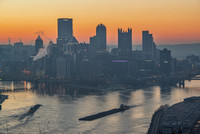 Barges cross at the Point in Pittsburgh at dawn