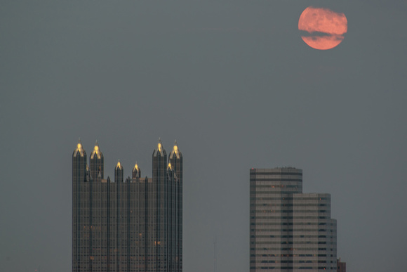 The Supermoon sits over Pittsburgh buildings