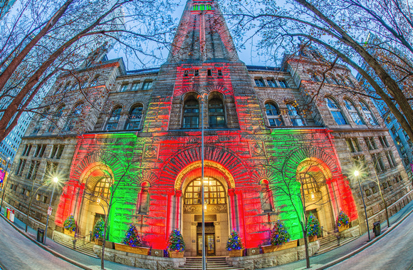 The Allegheny County Courthouse is lit up at Christmas through a fisheye lens