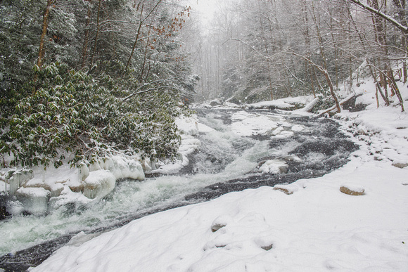 Looking up the natural rock slides at Meadow Run at Ohiopyle State Park in a snow storm