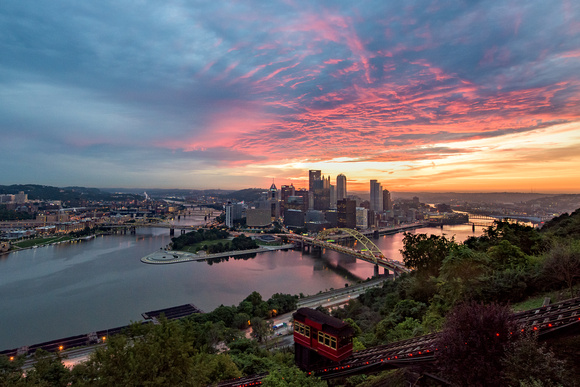 Colorful clouds spread over Pittsburgh before dawn