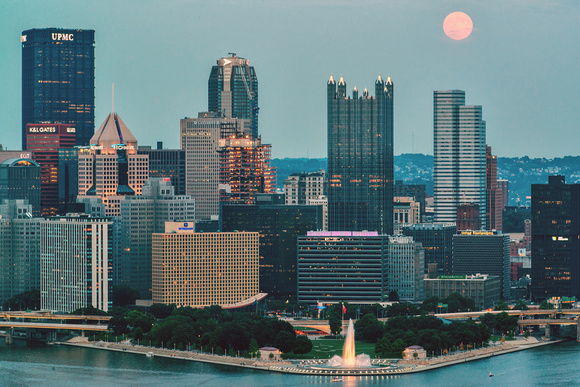 Pink supermoon over the Pittsburgh skyline at the blue hour