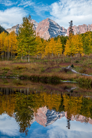 Maroon Peak reflects in a small pond in Colorado