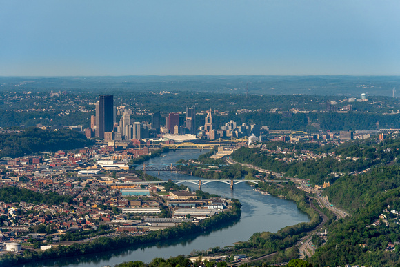 The Allegheny River winds into Pittsburgh at sunrise