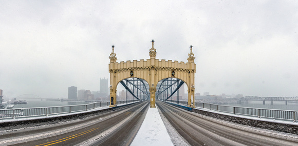 Panorama of a snowy Smithfield St. Bridge in Pittsburgh in winter