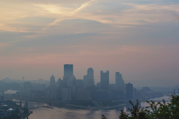 Colorful hazy Pittsburgh skyline from the West End Overlook