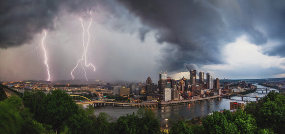 Lightning strikes over the Pittsburgh skyline during a spring thunderstorm copy