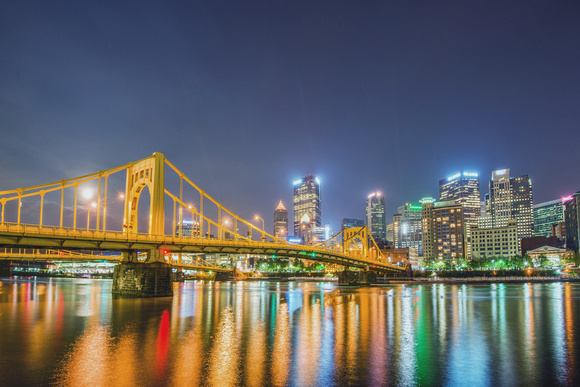 The Andy Warhol Bridge glows at night in Pittsburgh