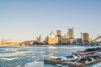 Snow on the barge on a sunny day and ice on the rivers in Pittsburgh in winter