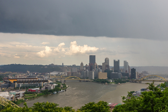 Clouds and sun over the Pittsburgh skyline from the West End Overlook