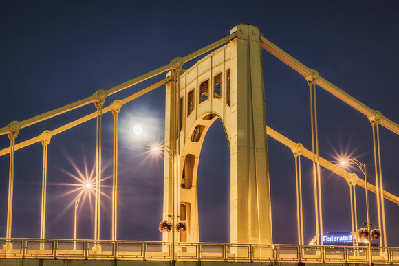 The harvest moon seen through the Andy Warhol Bridge HDR