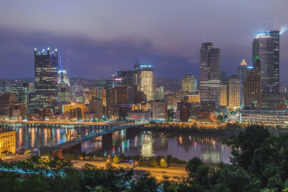 Pittsburgh skyline on a cloudy morning under a purple sky