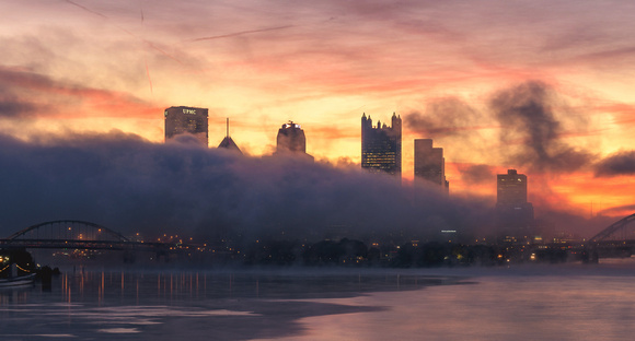 Fog covers part of Pittsburgh just before sunrise