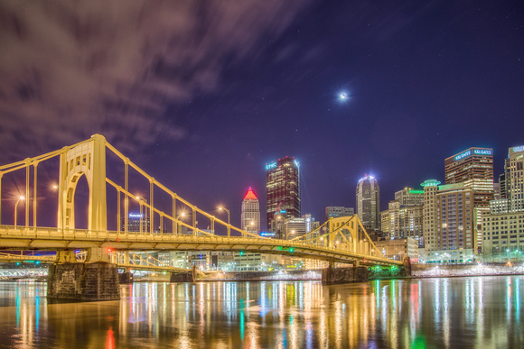 The moon hangs low over the Pittsburgh skyline