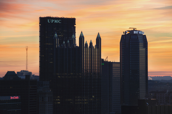Painted skies behind the Pittsburgh skyline at dawn