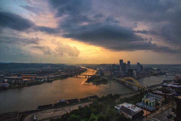 The sun breaks through the clouds over Pittsburgh after a storm