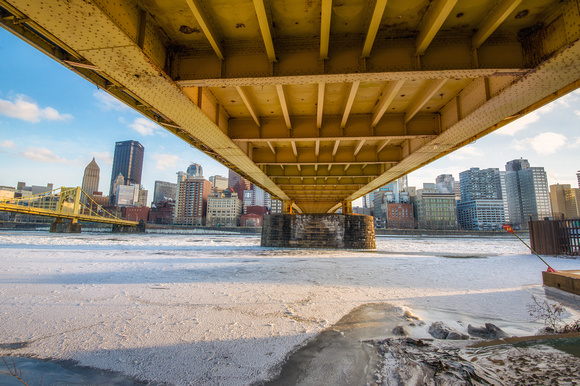 Under the Roberto Clemente Bridge in winter by ice on the Allegheny River