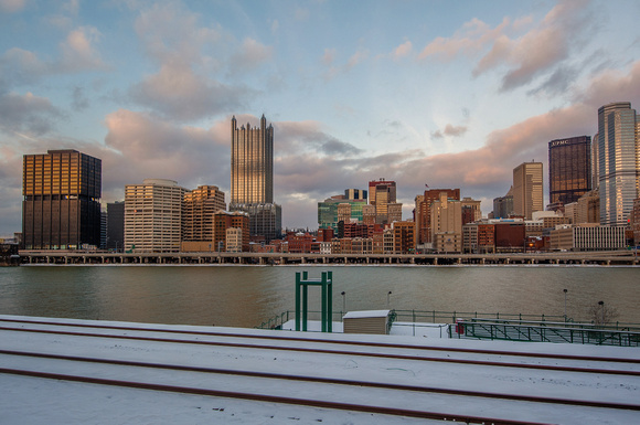 Snow covers the train tracks by Station Square in Pittsburgh