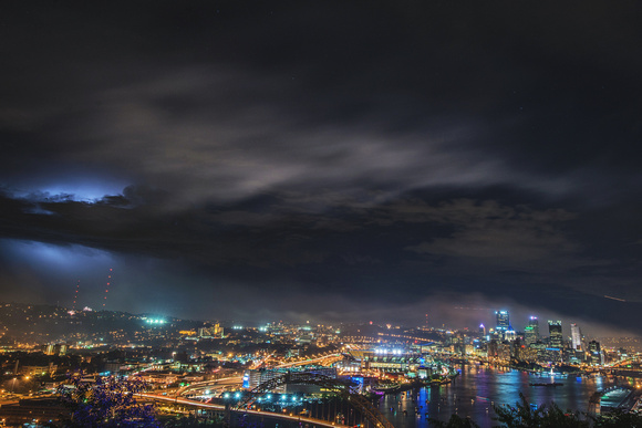 Lightning behind the clouds over Pittsburgh from the West End Overlook