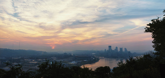 A colorful, hazy panorama from the West End Overlook in Pittsburgh