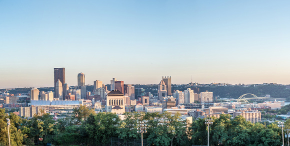 Panorama of the Pittsburgh skyline under blue skies from the North Side