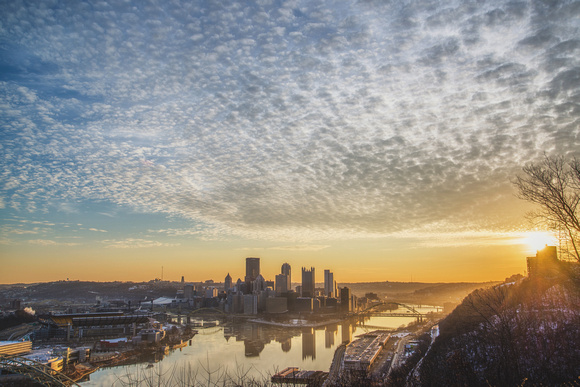 Sun rises over the Pittsburgh skyline from the West End Overlook