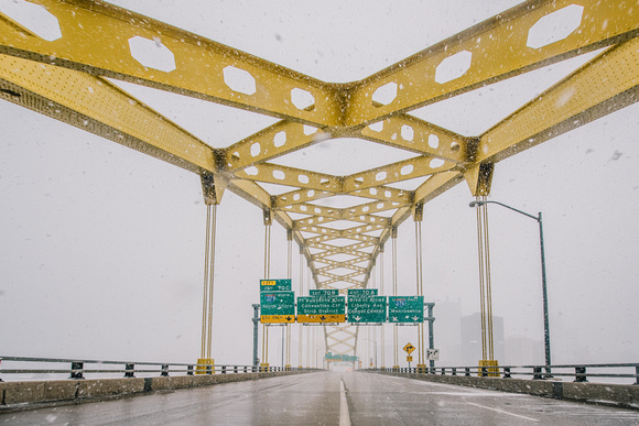 The Ft. Pitt Bridge in Pittsburgh stands out against the falling snow