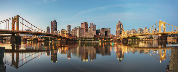 Panorama of Pittsburgh reflecting in the Allegheny at dawn
