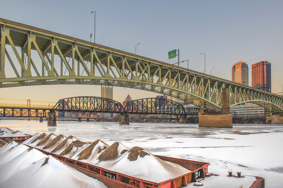 Under the Liberty Bridge in Pittsburgh over the icy Monongahela River and snow on barges