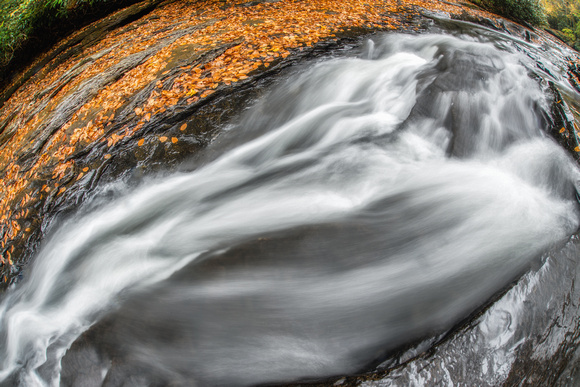 Water runs down the natural rock slides at Ohiopyle State Park in the fall