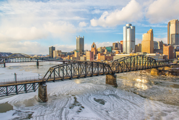 Ice covered Monongahela River at sunset in Pittsburgh