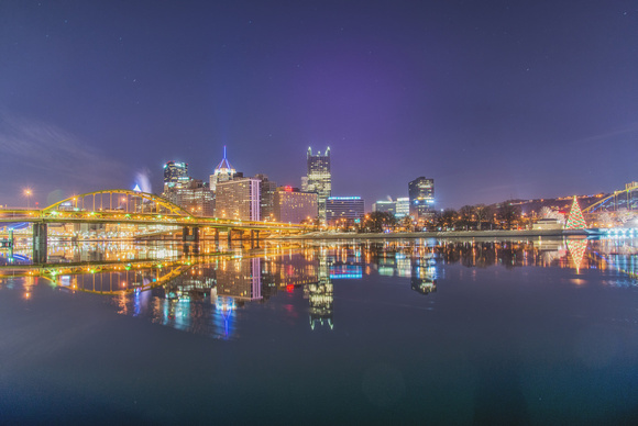 A wide angle view of the Pittsburgh skyline reflecting in the Allegheny River from the North Shore