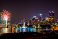 Fireworks over the fountain and a barge in Pittsburgh