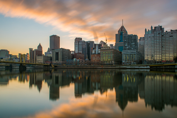 Clouds rush over still waters in Pittsburgh