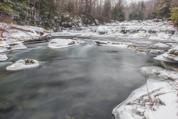 Wide angle view of the bottom of the Cascades at Ohiopyle State Park in the snow