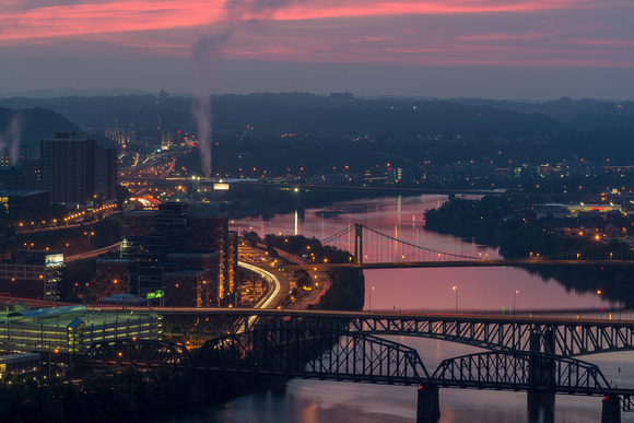 The sky reflects pink in the Monongahela River in PIttsburgh