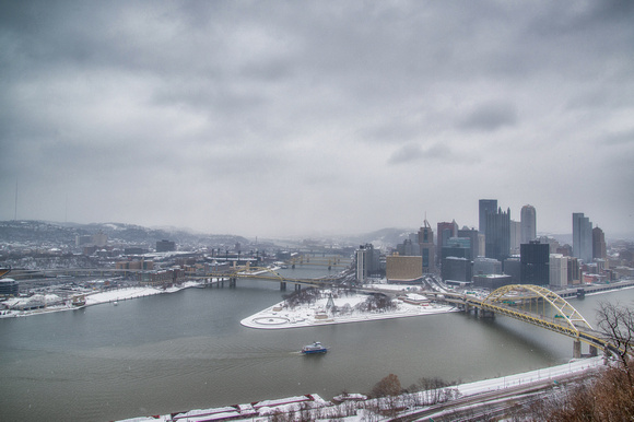 A wide angle view of the snowy Pittsburgh skyline from Mt. Washington