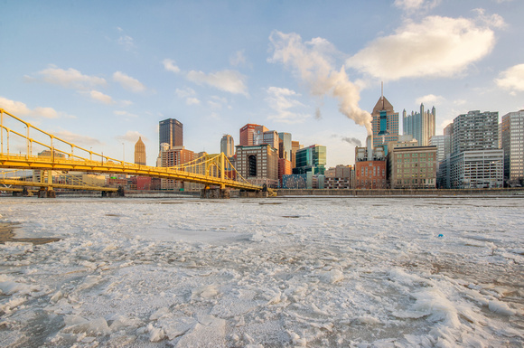 Ice on the Allegheny River and the Pittsburgh skyline at dusk HDR