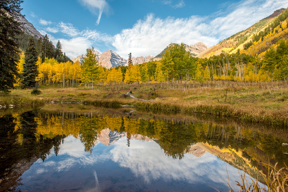 Reflections of Maroon Bells at dawn in Colorado