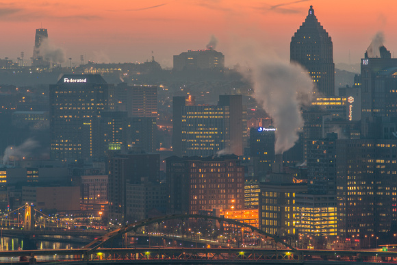 Pittsburgh glows under a red dawn