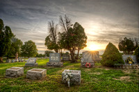 Sunset over graves at Evans City Cemetery HDR