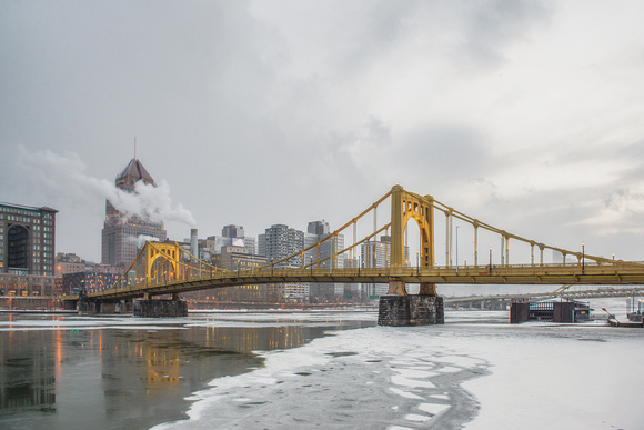 Roberto Clemente Bridge in the iced Allegheny River Pittsburgh winter