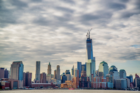 The New World Trade Center rises in the morning from Hoboken