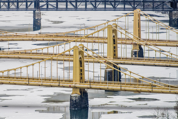 The Sister Bridges in Pittsburgh over an ice and snow covered Allegheny River