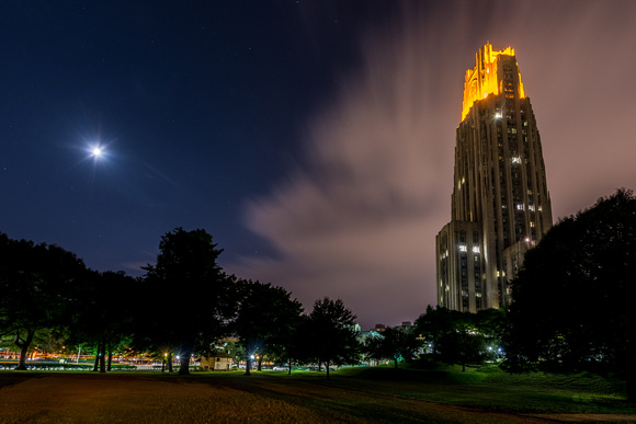The moon and Victory Lights on the Cathedral of Learning glow bright after Pitt defeated Penn State