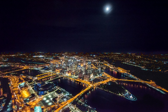 A full moon over Pittsburgh at night from the air